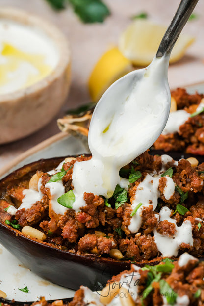 Mediterranean Stuffed Eggplant With Garlic Yogurt Sauce